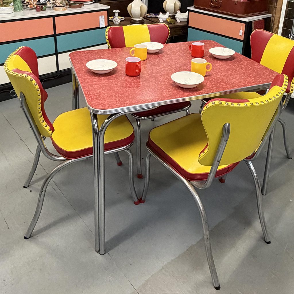 Vintage Red Formica Dinette Set with Yellow and Red Chairs in an Antique Shop Booth Mid-Century