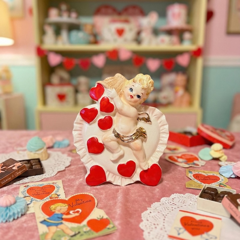 Vintage 1950s ceramic Valentine planter by Relpo featuring a cupid cherub girl  holding a large basket with red hearts, Mid-Century modern kitsch decor.